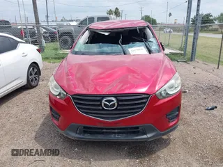 2016 Mazda CX-5 Sport with VIN JM3KE2BYXG0668401, listed as a IAAI auction lot 42370910 with Not provided miles and . Bid and sale history available at DreamBid. Image 13.