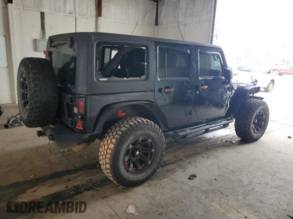 2012 Jeep Wrangler Unlimited Sahara with VIN 1C4BJWEG3CL195271, listed as a Copart auction lot 59947235 with 212,819 mi miles and Salvage title. Bid and sale history available at DreamBid. Image 3.