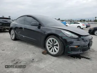 2022 Tesla Model 3 with VIN 5YJ3E1EA3NF190102, listed as a Copart auction lot 50657535 with 73,015 mi miles and Salvage Title. Bid and sale history available at DreamBid. Image 4.