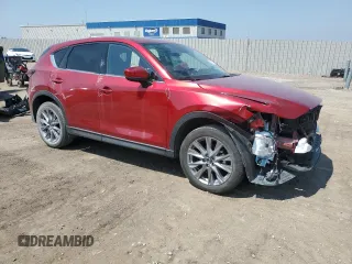 2019 Mazda CX-5 Grand Touring with VIN JM3KFBDM7K1668396, listed as a Copart auction lot 59732785 with 23,855 mi miles and Salvage title. Bid and sale history available at DreamBid. Image 4.