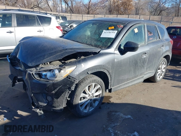 2014 Mazda CX-5 Grand Touring with VIN JM3KE2DY1E0421326, listed as a IAAI auction lot 41330794 with 127,589 mi miles. Bid and sale history available at carsss.com. Image 2.