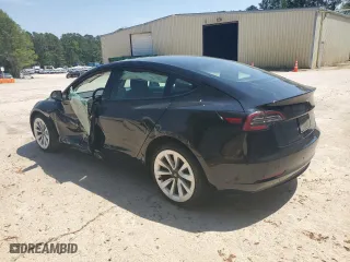 2023 Tesla Model 3 with VIN 5YJ3E1EA2PF438438, listed as a Copart auction lot 52901375 with 63,181 mi miles and Salvage Title. Bid and sale history available at carsss.com. Image 2.