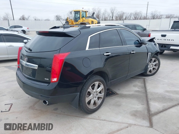 2015 Cadillac SRX Premium Collection z VIN 3GYFNDE3XFS576695, wystawiony jako IAAI lot #41612836 z przebiegiem Nie podano mil oraz . Historia ofert i sprzedaży dostępna na DreamBid. Obrazek 4.