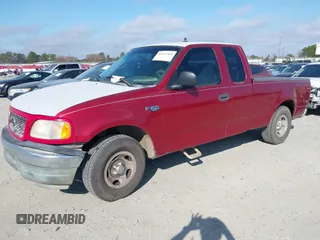2000 Ford F-150 XL with VIN 1FTZX1729YNC32076, listed as a IAAI auction lot 41523364 with 216,726 mi miles. Bid and sale history available at carsss.com. Image 17.