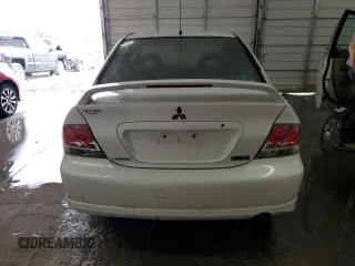 2004 Mitsubishi Lancer with VIN JA3AJ66F64U029144, listed as a Copart auction lot 77437234 with 158,049 mi miles and Salvage Title. Bid and sale history available at DreamBid. Image 6.