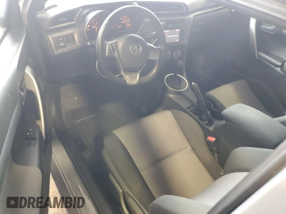 2014 Scion tC z VIN JTKJF5C7XE3071780, wystawiony jako Copart lot #47220975 z przebiegiem 102 630 mil mil oraz Szkody całkowita. Historia ofert i sprzedaży dostępna na DreamBid. Obrazek 8.