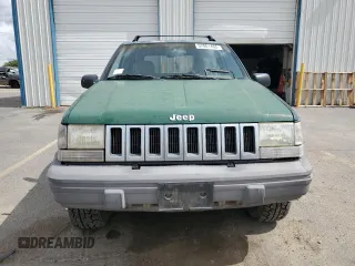 1993 Jeep Grand Cherokee Laredo with VIN 1J4GZ58Y8PC513026, listed as a Copart auction lot 57001465 with 135,242 mi miles and Clean title. Bid and sale history available at DreamBid. Image 5.
