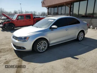 2014 Volkswagen Jetta TDI w/Premium/Nav z VIN 3VWLL7AJXEM321338, wystawiony jako Copart lot #48319955 z przebiegiem 215 719 mil mil oraz Szkoda całkowita • Salvage title. Historia ofert i sprzedaży dostępna na DreamBid. Obrazek 1.