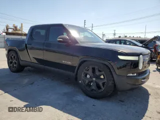 2023 Rivian R1T Adventure z VIN 7FCTGBAA6PN029702, wystawiony jako Copart lot #49833425 z przebiegiem 6608 mil mil oraz Szkody całkowita. Historia ofert i sprzedaży dostępna na DreamBid. Obrazek 4.