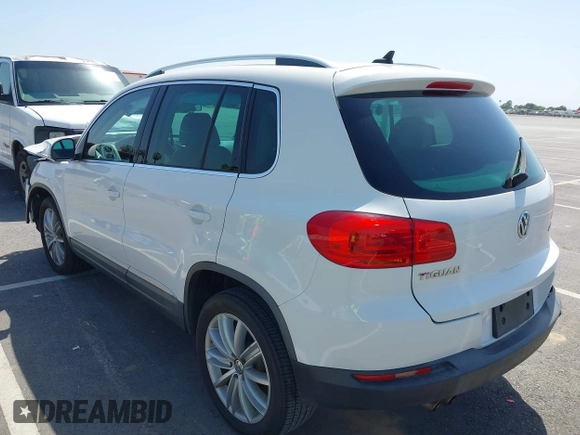 2014 Volkswagen Tiguan SEL with VIN WVGAV3AX9EW512956, listed as a IAAI auction lot 42110002 with 136,034 mi miles and . Bid and sale history available at DreamBid. Image 3.