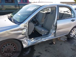 2006 Mitsubishi Lancer ES with VIN JA3AJ26E06U057959, listed as a IAAI auction lot 41347649 with 122,963 mi miles. Bid and sale history available at carsss.com. Image 6.