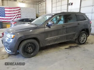 2017 Jeep Grand Cherokee Summit with VIN 1C4RJFJT4HC723876, listed as a Copart auction lot 52647205 with 97,412 mi miles and Salvage title. Bid and sale history available at DreamBid. Image 1.