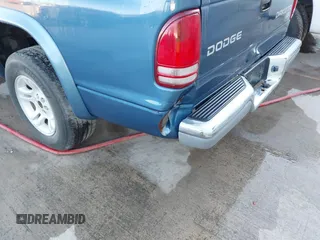 2003 Dodge Dakota SLT z VIN 1D7HL42N93S196397, wystawiony jako IAAI lot #42105857 z przebiegiem 159 690 mil mil oraz . Historia ofert i sprzedaży dostępna na DreamBid. Obrazek 6.