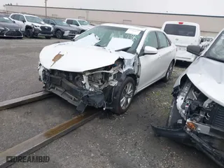 2015 Toyota Camry Hybrid LE with VIN 4T1BD1FK9FU148950, listed as a IAAI auction lot 41360155 with 106,069 mi miles. Bid and sale history available at carsss.com. Image 2.