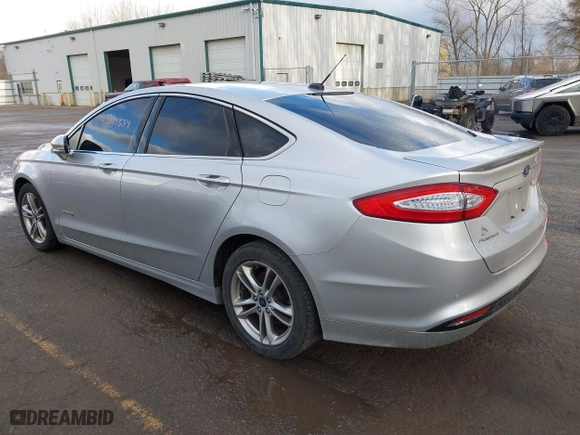 2015 Ford Fusion Titanium Hybrid with VIN 3FA6P0RU8FR181312, listed as a IAAI auction lot 42071584 with 99,955 mi miles. Bid and sale history available at carsss.com. Image 3.