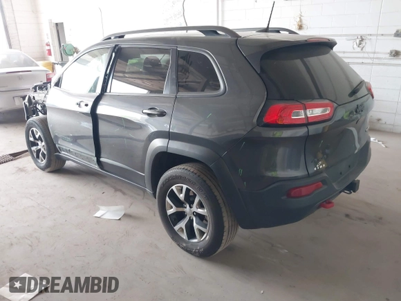 2016 Jeep Cherokee Trailhawk with VIN 1C4PJMBS0GW169184, listed as a IAAI auction lot 42255346 with 152,802 mi miles and . Bid and sale history available at DreamBid. Image 3.