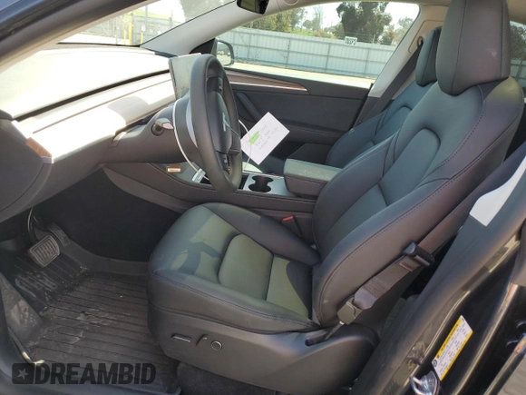 2025 Tesla Model Y Long Range with VIN 7SAYGDED4SF240354, listed as a Copart auction lot 52049745 with 6,785 mi miles and Salvage Title. Bid and sale history available at DreamBid. Image 7.