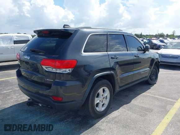 2014 Jeep Grand Cherokee Laredo with VIN 1C4RJEAG0EC179563, listed as a IAAI auction lot 39799427 with 209,169 mi miles and . Bid and sale history available at DreamBid. Image 4.