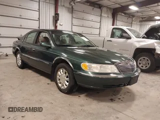 2001 Lincoln Continental with VIN 1LNHM97V11Y691910, listed as a IAAI auction lot 41501779 with 102,715 mi miles. Bid and sale history available at carsss.com. Image 1.