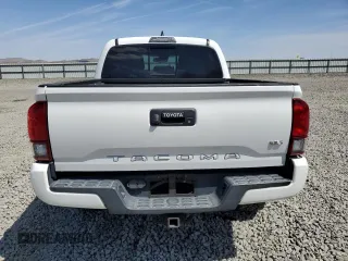 2019 Toyota Tacoma SR z VIN 3TMCZ5AN1KM263494, wystawiony jako Copart lot #54710695 z przebiegiem 57 216 mil mil oraz Szkoda całkowita • Salvage title. Historia ofert i sprzedaży dostępna na DreamBid. Obrazek 6.