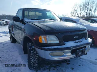 1997 Ford F-150 XL with VIN 1FTDF08W5VKD47103, listed as a IAAI auction lot 41345739 with 209,732 mi miles. Bid and sale history available at carsss.com. Image 1.