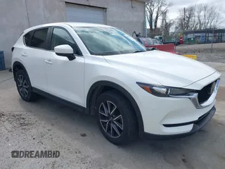 2018 Mazda CX-5 Touring with VIN JM3KFBCMXJ0353369, listed as a IAAI auction lot 41902554 with 154,104 mi miles and . Bid and sale history available at DreamBid. Image 1.