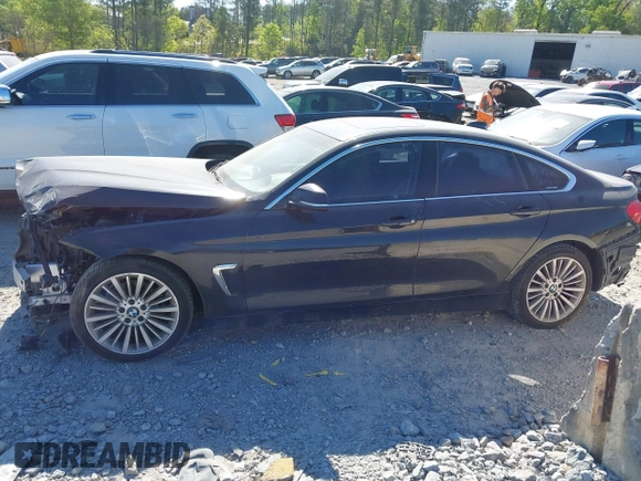 2015 BMW 4 Series 428i with VIN WBA4A5C51FG051393, listed as a IAAI auction lot 42041960 with 136,929 mi miles and . Bid and sale history available at carsss.com. Image 14.