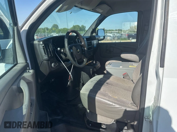 2014 Chevrolet Express Cargo with VIN 1GCWGFCA8E1121812, listed as a IAAI auction lot 42843730 with 128,506 mi miles and . Bid and sale history available at DreamBid. Image 6.