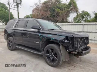 2020 Chevrolet Tahoe LT with VIN 1GNSCBKC5LR203301, listed as a Copart auction lot 57071315 with 106,376 mi miles and Salvage title. Bid and sale history available at DreamBid. Image 4.