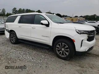 2021 Chevrolet Suburban LS with VIN 1GNSCBKD5MR392512, listed as a Copart auction lot 71238124 with 77,775 mi miles and Salvage Title. Bid and sale history available at DreamBid. Image 4.