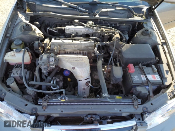 2000 Toyota Camry CE z VIN 4T1BG22K0YU692937, wystawiony jako Copart lot #57456985 z przebiegiem 116 617 mil mil oraz Szkoda całkowita • Salvage title. Historia ofert i sprzedaży dostępna na DreamBid. Obrazek 11.