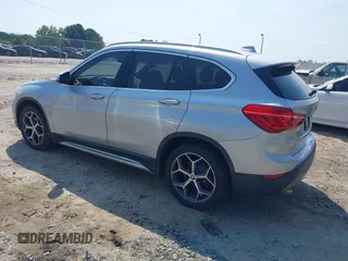 2018 BMW X1 xDrive28i with VIN WBXHT3C39J5L27926, listed as a IAAI auction lot 42582330 with 101,197 mi miles and . Bid and sale history available at DreamBid. Image 3.