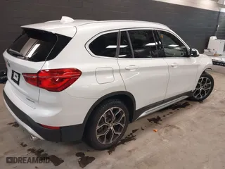 2021 BMW X1 xDrive28i with VIN WBXJG9C0XM5T76975, listed as a IAAI auction lot 41310115 with 26,869 mi miles. Bid and sale history available at carsss.com. Image 4.