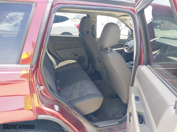 2009 Jeep Grand Cherokee Laredo with VIN 1J8GS48K39C521160, listed as a IAAI auction lot 42039577 with 262,829 mi miles. Bid and sale history available at carsss.com. Image 8.