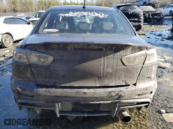 2014 Mitsubishi Lancer Evolution GSR z VIN JA32W8FV6EU010233, wystawiony jako Copart lot #42787275 z przebiegiem 74 780 mil mil oraz Szkody całkowita. Historia ofert i sprzedaży dostępna na DreamBid. Obrazek 6.