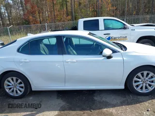 2020 Toyota Camry LE with VIN 4T1C11AKXLU986310, listed as a IAAI auction lot 40977100 with 108,208 mi miles and . Bid and sale history available at DreamBid. Image 13.