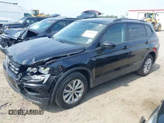 2020 Volkswagen Tiguan S with VIN 3VV1B7AX1LM086019, listed as a IAAI auction lot 42458434 with 114,413 mi miles and . Bid and sale history available at DreamBid. Image 2.