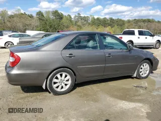 2003 Toyota Camry LE with VIN 4T1BE30K43U724778, listed as a Copart auction lot 53515605 with 176,568 mi miles and Salvage Title. Bid and sale history available at DreamBid. Image 3.