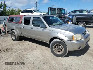 2004 Nissan Frontier XE with VIN 1N6ED29X24C436064, listed as a Copart auction lot 58916434 with 277,026 mi miles and Salvage title. Bid and sale history available at DreamBid. Image 4.