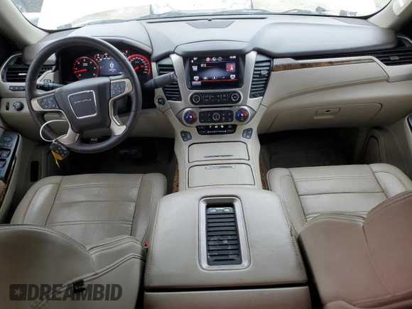 2015 GMC Yukon Denali with VIN 1GKS1CKJ1FR619793, listed as a Copart auction lot 86910314 with 128,559 mi miles and Salvage Title. Bid and sale history available at carsss.com. Image 8.