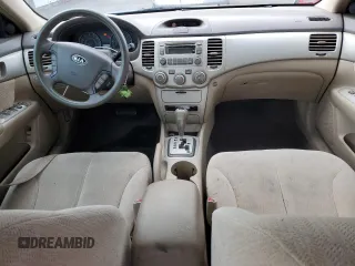 2008 Kia Optima LX z VIN KNAGE124385198719, wystawiony jako Copart lot #55449255 z przebiegiem 156 972 mil mil oraz Szkoda całkowita • Salvage title. Historia ofert i sprzedaży dostępna na DreamBid. Obrazek 8.