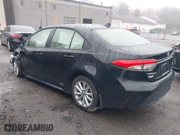 2023 Toyota Corolla Hybrid LE with VIN JTDBDMHE1P3001381, listed as a IAAI auction lot 41898054 with 76,971 mi miles. Bid and sale history available at carsss.com. Image 3.
