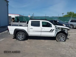 2013 Toyota Tacoma with VIN 3TMLU4EN9DM113137, listed as a IAAI auction lot 41709140 with 57,704 mi miles and . Bid and sale history available at DreamBid. Image 14.