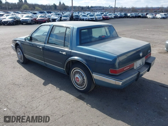 1986 Cadillac Seville z VIN 1G6KS6989GU813079, wystawiony jako IAAI lot #41732353 z przebiegiem Nie podano mil oraz . Historia ofert i sprzedaży dostępna na DreamBid. Obrazek 3.
