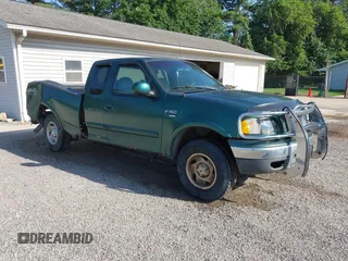 1999 Ford F-150 with VIN 1FTRX18W4XNA50527, listed as a IAAI auction lot 42563746 with 213,959 mi miles and . Bid and sale history available at DreamBid. Image 1.