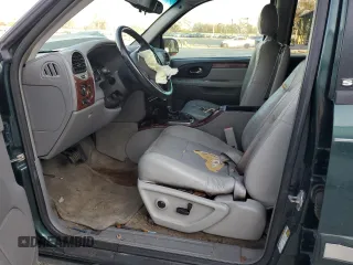 2005 GMC Envoy SLT with VIN 1GKDS13S652329610, listed as a Copart auction lot 76384914 with Not Provided miles and Salvage Title. Bid and sale history available at DreamBid. Image 7.