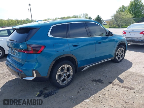 2023 BMW X1 xDrive28i with VIN WBX73EF00P5W52935, listed as a IAAI auction lot 42221084 with 16,394 mi miles and . Bid and sale history available at DreamBid. Image 4.