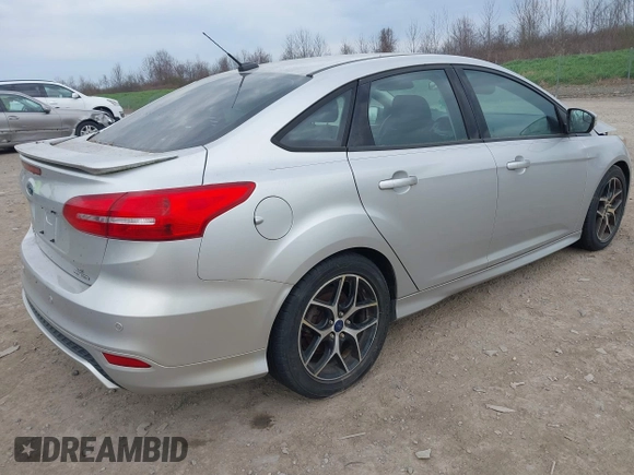 2016 Ford Focus SE with VIN 1FADP3F20GL228831, listed as a IAAI auction lot 42115033 with 106,975 mi miles. Bid and sale history available at carsss.com. Image 4.