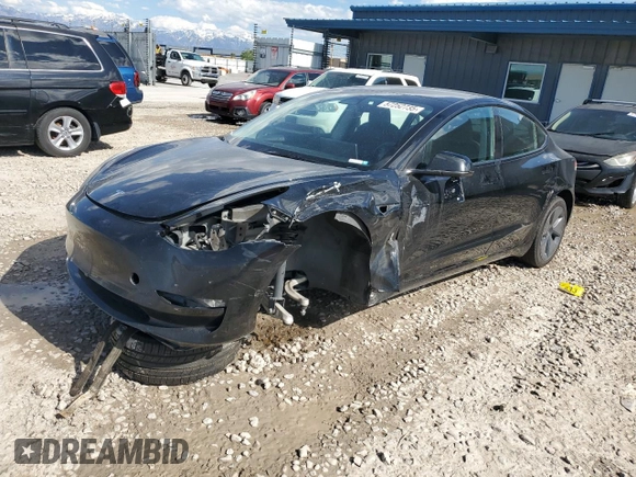2023 Tesla Model 3 with VIN 5YJ3E1EAXPF708001, listed as a Copart auction lot 57252735 with 71,579 mi miles and Salvage title. Bid and sale history available at DreamBid. Image 1.