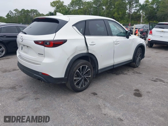 2023 Mazda CX-5 2.5 S Premium Package with VIN JM3KFBDM1P0126787, listed as a IAAI auction lot 41164586 with 12,076 mi miles. Bid and sale history available at carsss.com. Image 4.